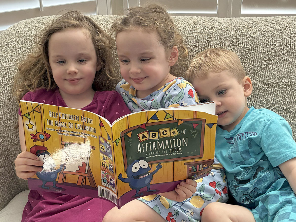 Twins reading the ABCs of Affirmation to little brother